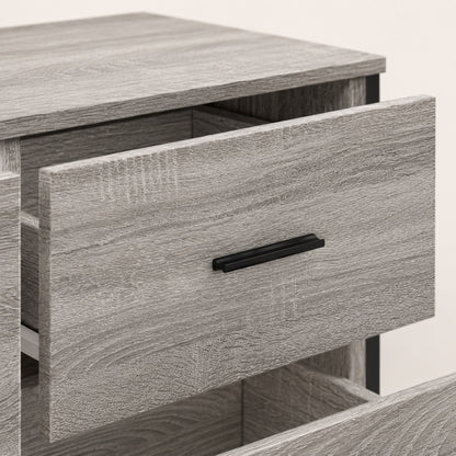 Détail d’un tiroir de la commode grise Oslo avec finition bois texturée et poignée noire