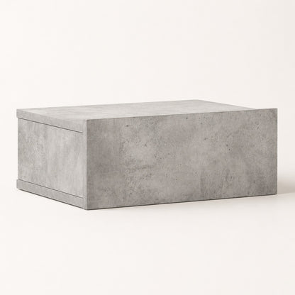 Table de chevet suspendue effet béton avec finition contemporaine et tiroir au design épuré.