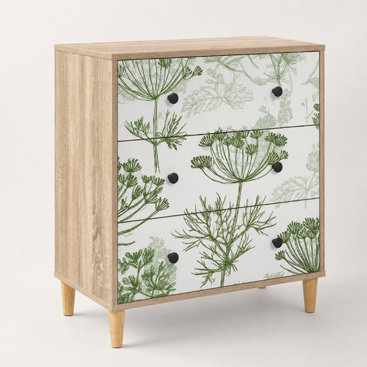 Commode 3 tiroirs Dalia au design floral vert, structure effet bois clair et poignées noires.