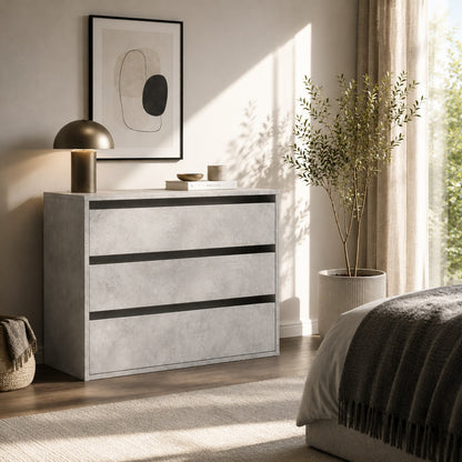 Commode 3 tiroirs effet béton dans une chambre élégante au style moderne et épuré.