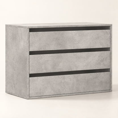 Commode 3 tiroirs finition effet béton au design contemporain pour une chambre moderne.