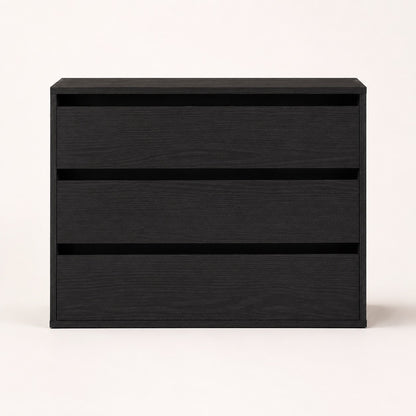 Commode noire 3 tiroirs au design minimaliste avec façade épurée pour chambre contemporaine.